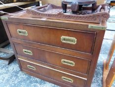 A BRASS MOUNTED CAMPAIGN CHEST OF THREE DRAWERS