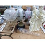 FOUR TABLE LAMPS, A THREE KINGS FIGURE AN OIL LAMP, AND A BRASS FOOTMAN.