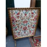AN EMBROIDERED PANEL FOLDING SCREEN / TABLE.