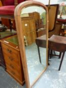 A LARGE VICTORIAN ARCH TOP MIRROR.