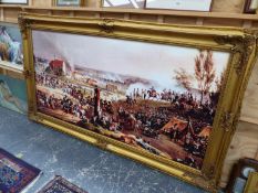 A DECORATIVE PICTURE IN A SWEPT GILT FRAME OF A BATTLE SCENE POSSIBLY WATERLOO. 90 x 182cms