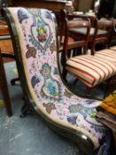 AN EBONISED NURSING CHAIR UPHOLSTERED IN FLORAL BEAD WORK