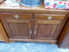 AN OAK SIDE CABINET WITH TWO DRAWERS OVER CUPBOARDS. W 121 x D 45 x H 92cms.