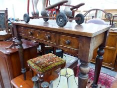 A MAHOGANY THREE DRAWER SIDE TABLE ON TAPERING CYLINDRICAL LEGS