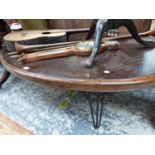 A MAHOGANY OVAL COFFEE TABLE ON IRON LEGS
