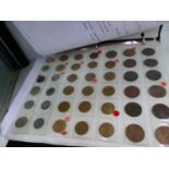 AN ALBUM OF ASSORTED COINS.