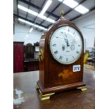 A COMITTI OF LONDON INLAID MANTLE CLOCK WITH BRASS FEET.