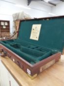AN ANTIQUE OAK AND LEATHER BOUND DOUBLE GUN CASE FOR WESTLEY, RICHARDS AND CO.
