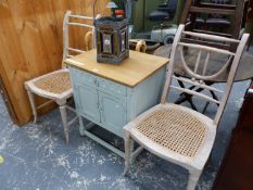 A PAINTED SMALL SIDE CABINET, AND A PAIR OF LIME WASHED SIDE CHAIRS WITH CANE SEATS. THE CABINET W