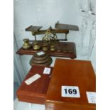 A SET OF POSTAL SCALES WITH BELL WEIGHTS, OTHER SCALE WEIGHTS ETC.