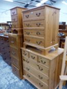 A PINE BEDSIDE CHEST OF THREE DRAWERS TOGETHER WITH A PINE CHEST OF FOUR DRAWERS AND ANOTHER LARGER