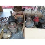 A QUANTITY OF TILLY LAMPS, VINTAGE STOVES, AND A RAILWAY LANTERN.