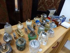 A LARGE COLLECTION OF GLASS AND STONE TABLE LIGHTERS, TOGETHER WITH A ELECTRONIC TRIGERS LIGHTER.