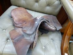 A VINTAGE HORSE SADDLE.