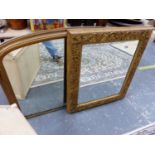 A VICTORIAN GILT FRAMED OVAL MANTLE MIRROR AND A FURTHER CARVED GILT WOOD FRAME WITH INSET MIRROR.