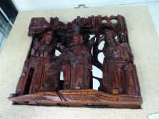 A CHINESE CARVED HARDWOOD PANEL.