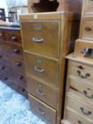 AN OAK FOUR DRAWER FILING CABINET. W 49 x D 66 x H 99cms.