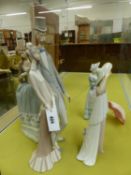 FOUR LLADRO FIGURES, TO INCLUDE: THREE ELEGANT LADIES, THE TALLEST OF AN ELDERLY COUPLE. H 50cms.