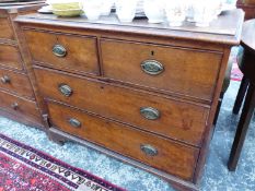 AN OAK CHEST OF TWO SHORT AND THREE LONG DRAWERS ON BRACKET FEET