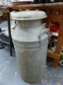 AN ALUMINIUM MILK CHURN.