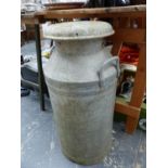 AN ALUMINIUM MILK CHURN.