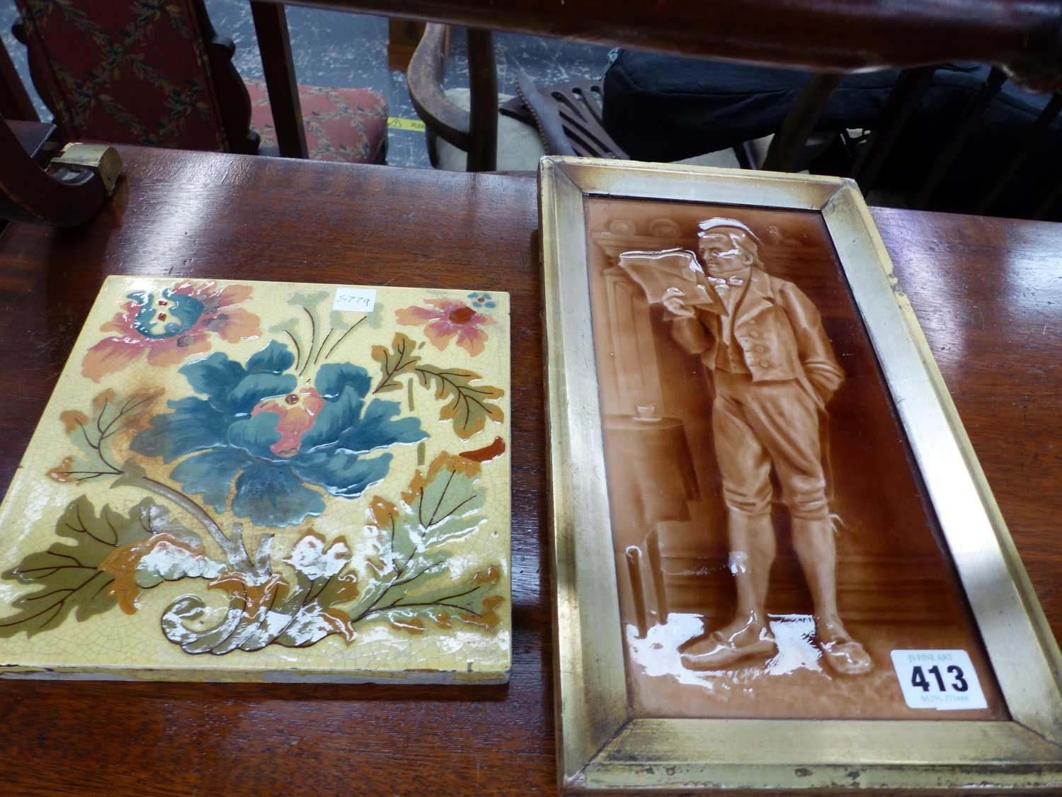 AN ANTIQUE PORCELAIN PANEL DEPICTING A DICKENSIAN CHARACTER, AND ONE FURTHER TILE.