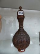 A PERSIAN REPOUSSE LIDDED VESSLE.