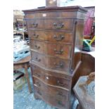 A MAHOGANY SERPENTINE FRONTED CHEST ON CHEST. W 70 x D 46 x H 149cms