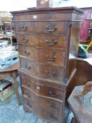 A MAHOGANY SERPENTINE FRONTED CHEST ON CHEST. W 70 x D 46 x H 149cms