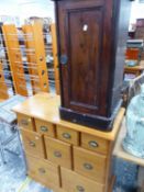 A MAHOGANY BEDSIDE CUPBOARD TOGETHER WITH A PINE CHEST OF NINE DRAWERS