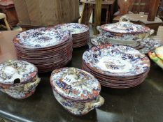 A VICTORIAN IRONSTONE PART DINNER SERVICE TO INCLUDE THREE TUREENS, SEVEN SOUP BOWLS, THIRTEEN SIDE