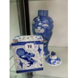 AN ORIENTAL BLUE AND WHITE BRICK VASE, AND A LIDDED VASE.