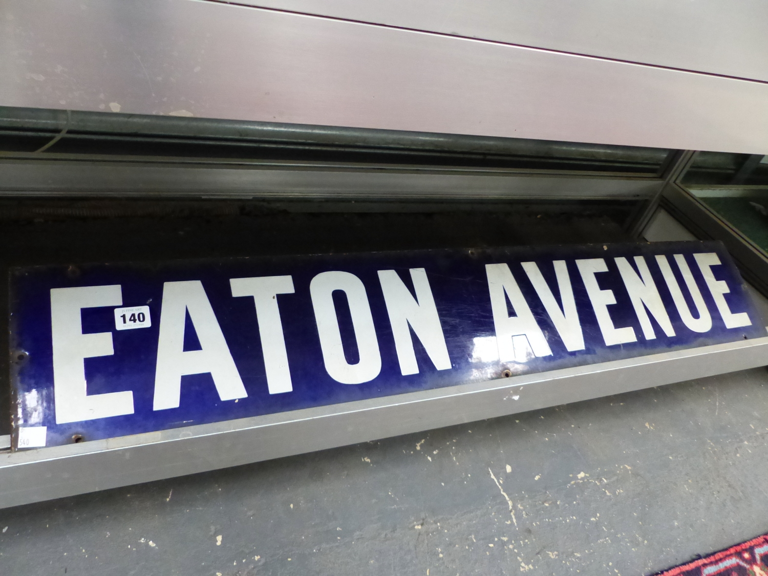 A BLUE AND WHITE ENAMEL STREET SIGN "EATON AVENUE"