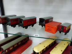 FOUR VARIOUS HORNBY BOXED O GAUGE RED LIVERIED CARRIAGES TOGETHER WITH A No. 21 COACH