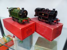 A HORNBY BOXED O GAUGE CLOCKWORK GWR 040 LOCOMOTIVE TOGETHER WITH A BLACK BRITISH RAIL 040