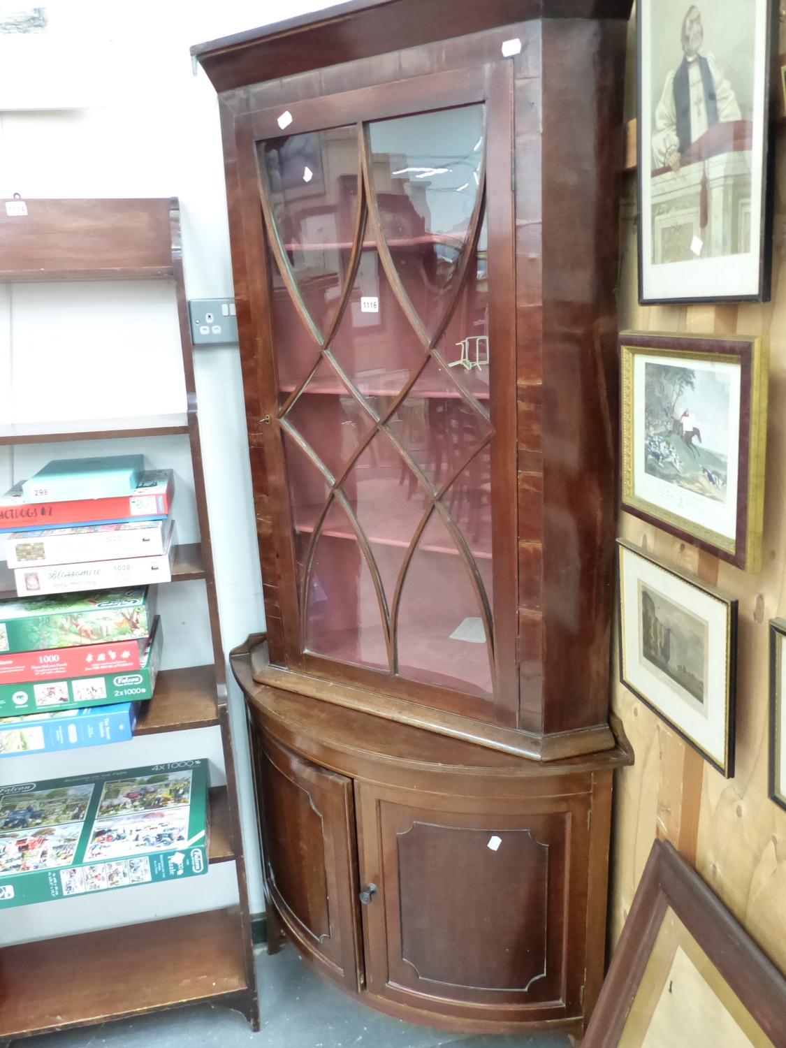 AN ASTRAGAL GLAZED MAHOGANY CORNER CUPBOARD TOGETHER WITH A ROUND FRONTED CORNER CUPBOARD