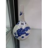 CHINESE BLUE AND WHITE DRAGON DECORATED BOTTLE VASE.