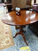 A MAHOGANY CIRCULAR TOPPED TRIPOD TABLE