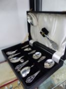 A HALLMARKED SILVER SET OF DESSERT SPOONS AND SERVER CASED.