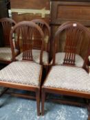 A SET OF FIVE MAHOGANY ROUND ARCHED BACKED DINING CHAIRS WITH DROP IN SEATS