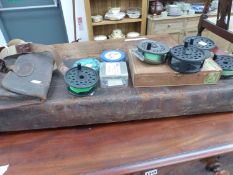 VARIOUS FISHING REELS, A LEATHER GUN CASE, AND A CARTRIDGE BAG.