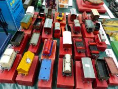 TWENTY NINE HORNBY BOXED O GAUGE WAGONS, TANKERS, A TENDER AND A CRANE