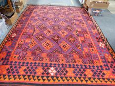 A LARGE TRIBAL KELIM CARPET 329 X 228 CM