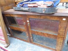 A GLAZED BURR WALNUT BOOK SHELF. W 113 x D 27 x H 66cms.