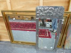 A VINTAGE REPOUSSE PEWTER BEVEL PLATE MIRROR. 68 x 32cms. TOGETHER WITH A BRASS FRAME CONTEMPORARY