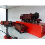 A HORNBY BOXED O GAUGE CLOCKWORK LMS 442 LOCOMOTIVE AND TENDER TOGETHER WITH AN LMS 040 LOCOMOTIVE