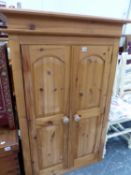 A SMALL PINE WARDROBE, UPPER SECTION. W 82 X D 54 X H 131CMS.