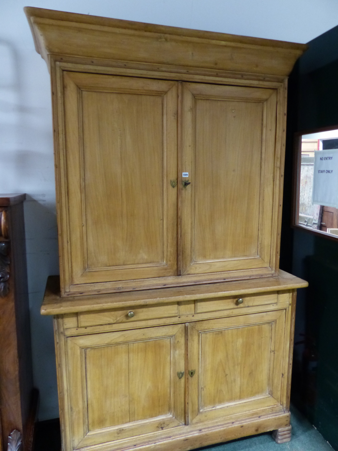 A PINE LINEN PRESS WITH CUPBOARDS ABOVE AND BELOW TWO CENTRAL DRAWERS. W 137 x D 54 x H 225cms.