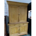 A PINE LINEN PRESS WITH CUPBOARDS ABOVE AND BELOW TWO CENTRAL DRAWERS. W 137 x D 54 x H 225cms.