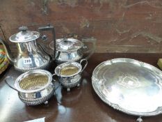 A SILVER PLATED FOUR PIECE TEA SET AND A TRAY.